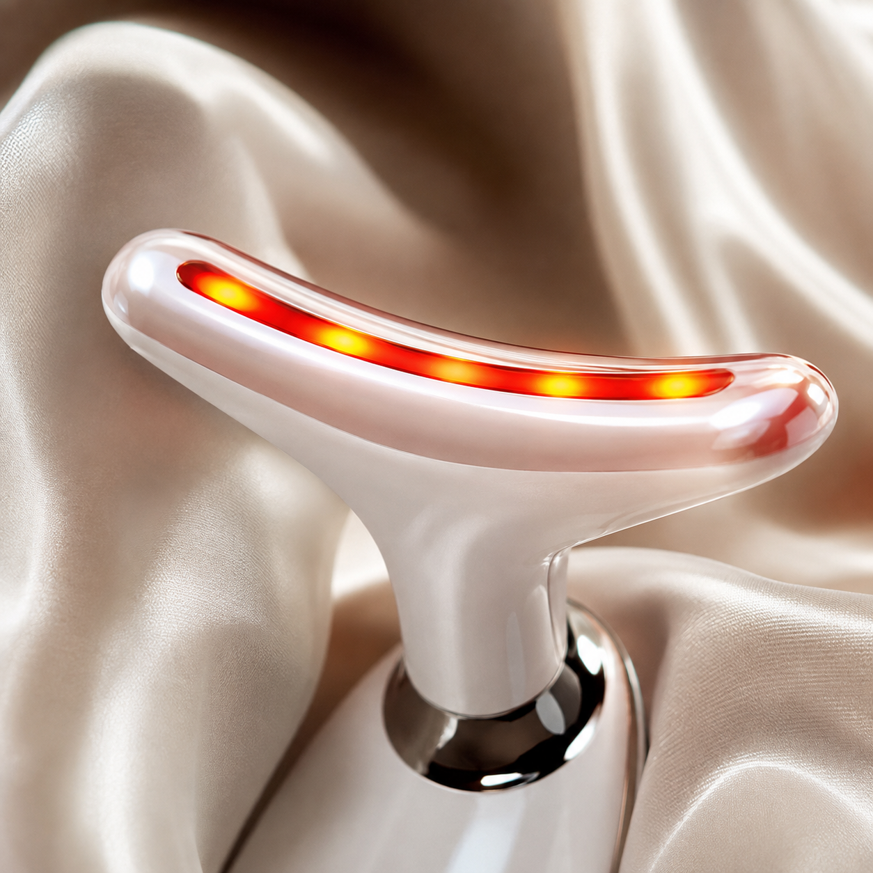 Macro of the LumiCurve massage head with red LED glow